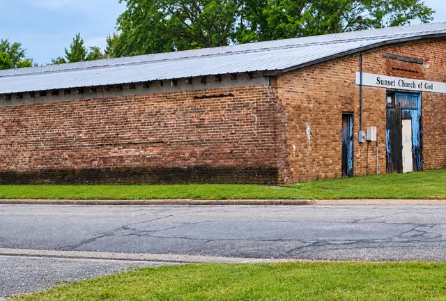 Restored visualization of the church’s second home, a weathered brick building